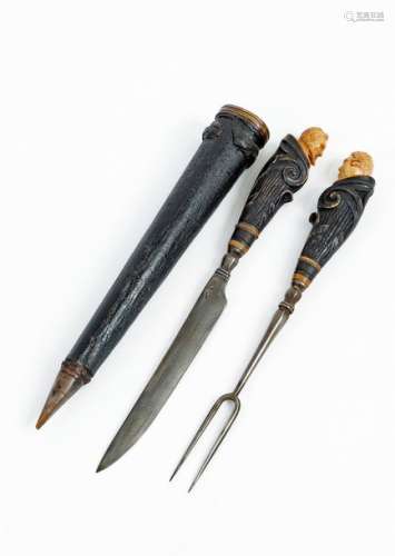 Pair of Renaissance style travel cutlery with leather and copper case Carved and partially blackened andouillerhorn and steelGerman work, late 17th-early 18thcentury Total length: 26,5 cm