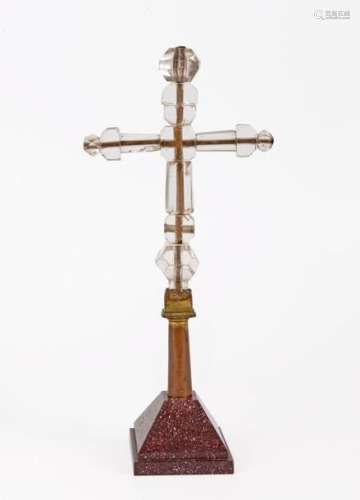Important processional cross in cut rock crystal and gilded copper, mounted on a porphyrypedestal Spanish work (Catalonia)XIII-XIVH (total): 43.5 cm(accidents)A similar model is kept at the Museo Civico d'Arte Antica, Palazzo Madama, TurinProvenance: Sotheby's London, sale 31 October 2007, lot no. 335