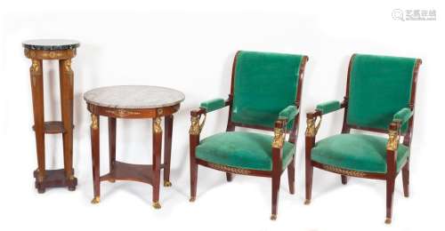 A pair of armchairs, a round pedestal table and a gildedbronze and mahogany Empire style pedestal table and saddle with caryatid-like legs connected by spacer plates, marbleshelves Period circa 190074.5 x 71 x 71 cm (pedestal table)110 x 41 x 41 cm (saddle)Restoration to the pedestal table