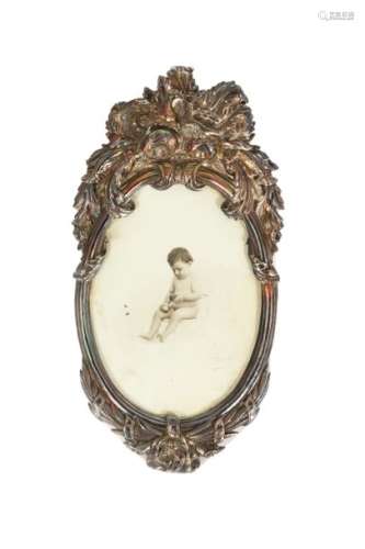 Transition style oval photo frame in embossed silver decorated with a couple of interlaceddoves Unpunched, woodenbase 19thcentury 35 x 18 cm