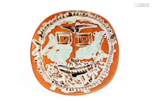 Pablo PICASSO (1881-1973)Face with square eyes, 1959Round/square plate in white earthenware, decorated with ceramic pastel pencils, engobe under partial cover with a brushRed, ivory, green and blackpatina Numbered 57/100, bears on the back the hollow seals 