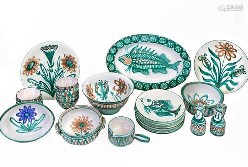 Robert PICAULT (1919-2000) and VALLAURISSet of 30 glazed ceramic pieces, each signed, decorated with fish and flowers in shades of green and brown on a whitebackground Comprising eight plates, a salad bowl, twelve bowls, a large oval deep dish, two round dishes, a frying pan, a terrine, two bowls, an oiler and a vinegarmaker Around 1950(accidents)