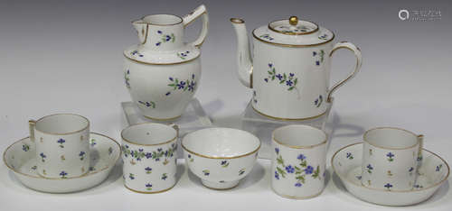 A Paris porcelain Cornflower pattern teapot and cover and jug, early 19th century, with gilt rims,