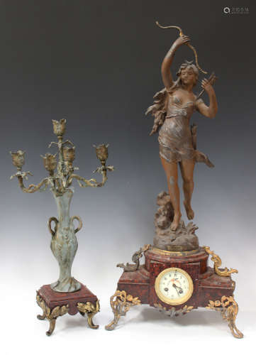 An early 20th century spelter and rouge marble mantel clock with eight day movement striking on a