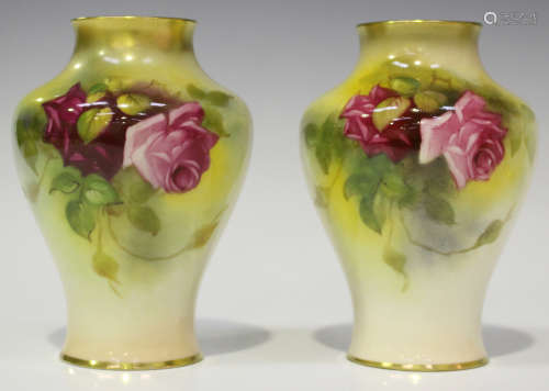 A pair of Royal Worcester vases, circa 1925-29, painted by M. Hunt, signed, each with roses