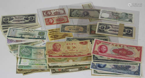 A group of Asian banknotes, mostly Chinese, including a Chinese ten yuan 1940, a five yuan 1914, a