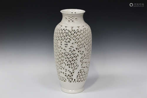 A Chinese white glazed porcelain table lamp vase, 20th century, pierced and moulded with bamboo