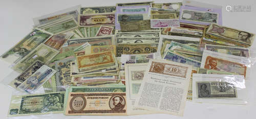 A group of world banknotes, including a USA Commercial Bank of Glen's Falls two dollars 1864 and a