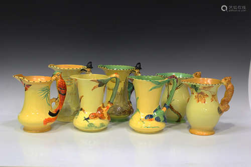 Seven Burleigh Ware naturalistic jugs, including a similar pair with each handle moulded as the Pied