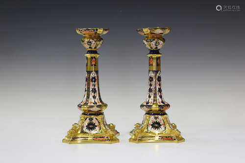 A pair of Royal Crown Derby 1128 Imari pattern dolphin lampbase candlesticks, late 20th century,