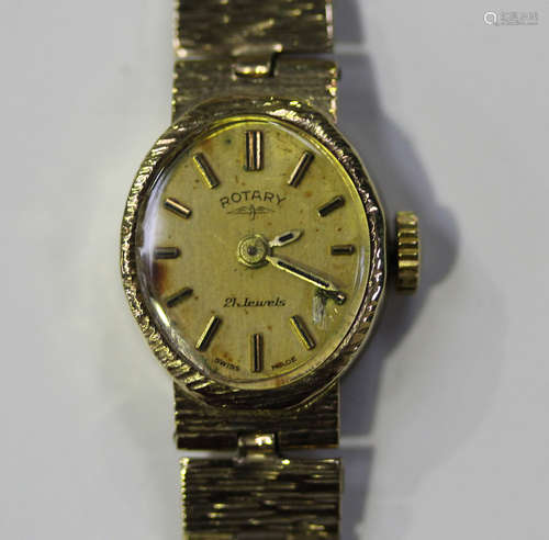 A Rotary 9ct gold lady's bracelet wristwatch, the signed oval gilt dial with baton hour markers,