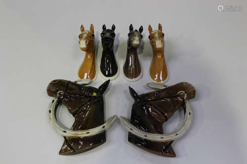 A pair of Beswick horse's head wall masks, each modelled with a horseshoe, Nos. 806 and 807,