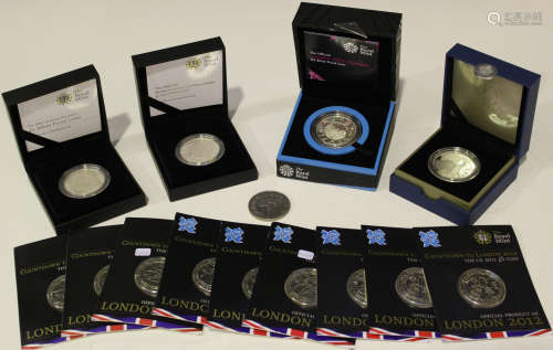 A collection of Royal Mint commemorative coins, including a London Olympics silver proof five pounds