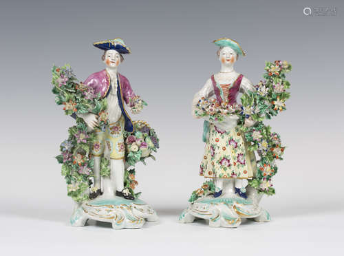 A pair of Bow porcelain figures, circa 1760, modelled as an elegant lady and gentleman standing