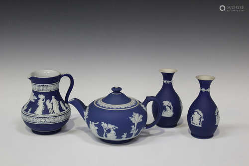 A small group of mostly Wedgwood blue dip jasperware, 20th century, typically ornamented in white