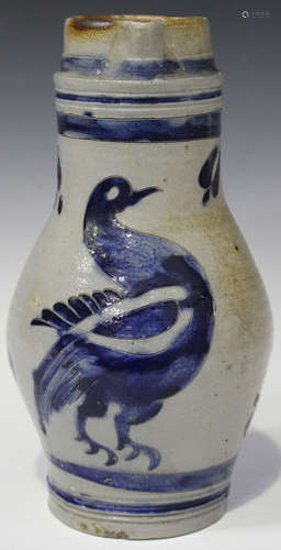 A Westerwald stoneware jug, 19th century, the pear shaped body decorated with a bird within a