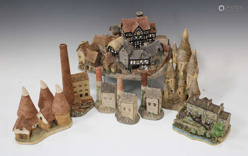 A group of David Winter and similar resin houses, including 'The Village' and three Cornish tin