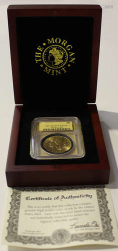 A USA gold twenty dollars 1899, slabbed and cased.