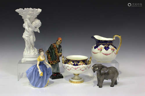 A small group of decorative ceramics, including two Royal Doulton figures, The Carpet Seller, HN1464