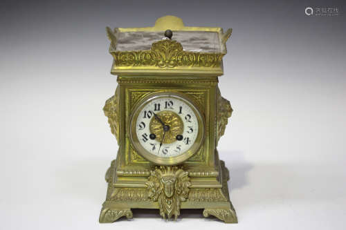 A late 19th century French brass cased mantel clock with eight day movement striking on a gong,