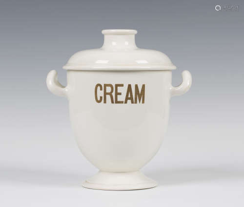 A Wedgwood pottery cream cooler and cover, circa 1825, the off-white glazed body of U-shape, flanked