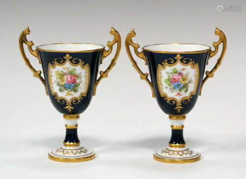 A diminutive pair of Royal Crown Derby vases, circa 1914, of trophy shape, the cobalt blue ground