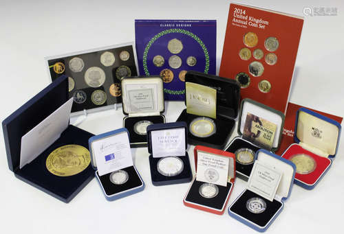 A collection of Royal Mint and other commemorative coins, including a Westminster Mint silver-plated