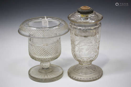 A Bohemian clear glass oil lamp base and reservoir, circa 1900, engraved with a bird amongst