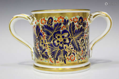 An Imari decorated loving cup, probably Coalport, early 19th century, with a dense pattern of gilt