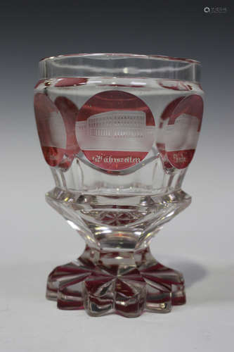 A Bohemian pink flashed spa beaker, late 19th century, the hexagonal body engraved with six named