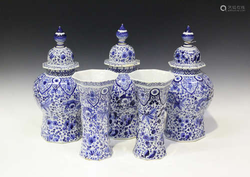 A garniture of five Dutch Delft vases and three covers, 19th century, of octagonal shape, three