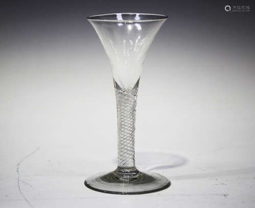 An airtwist stem wine glass, circa 1760, the drawn trumpet bowl above a plain stem with multi-spiral