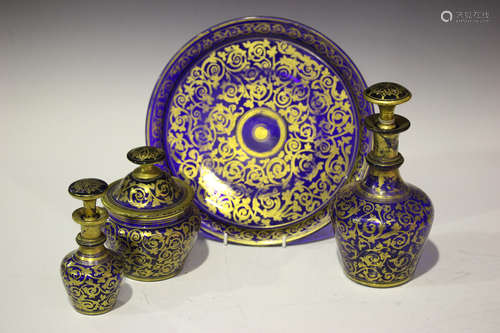 A Bohemian, probably for the Islamic market, blue glass and foliate gilt decorated drinks set,