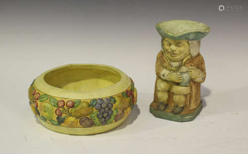 A Compton pottery bowl, the sides moulded with fruit, impressed mark to base, diameter 21.5cm,