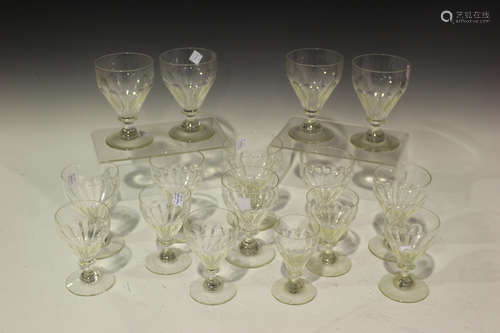 A part suite of glasses, early 20th century, each with panel cut bowl, comprising five red wine,