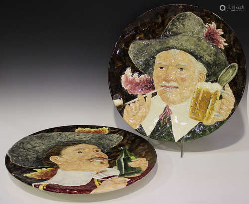 A large pair of Sarreguemines majolica circular chargers, 20th century, each moulded in relief and