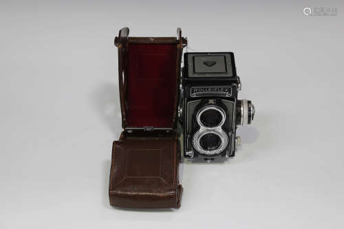 A Franke & Heidecke Rolleiflex T grey and black cased twin lens reflex camera, serial No. 'T
