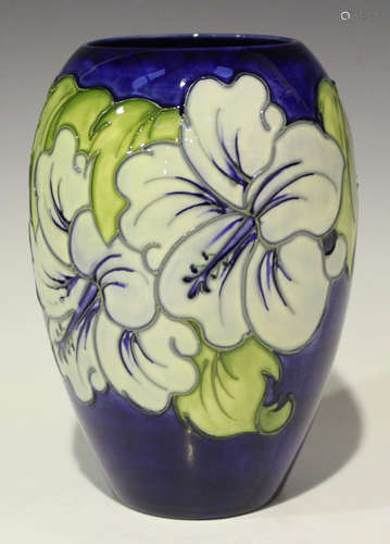 A Moorcroft pottery Hibiscus pattern vase, circa 1986-88, decorated in the pale and dark blue