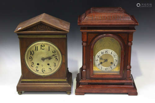 An early 20th century German stained beech cased mantel clock with eight day movement striking on