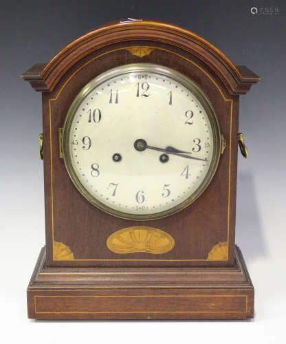 An early 20th century mahogany bracket clock with eight day movement striking on a gong, the