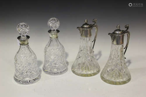 A pair of silver mounted cut glass decanters and stoppers, each of bell form, Birmingham 1994 by