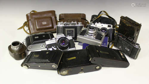 A collection of assorted cameras and accessories, including a Ross Ensign Selfix 820 special folding