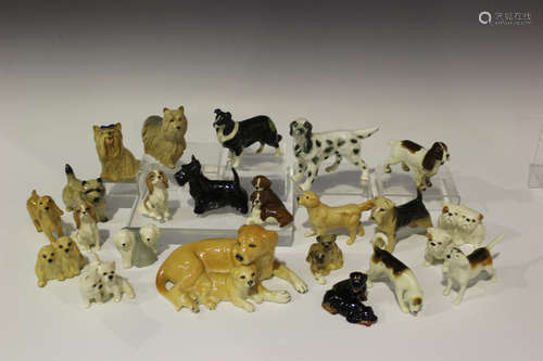 Twenty-two assorted Beswick dog models, including seated Hounds, No. 3375, seated Cocker Spaniels,