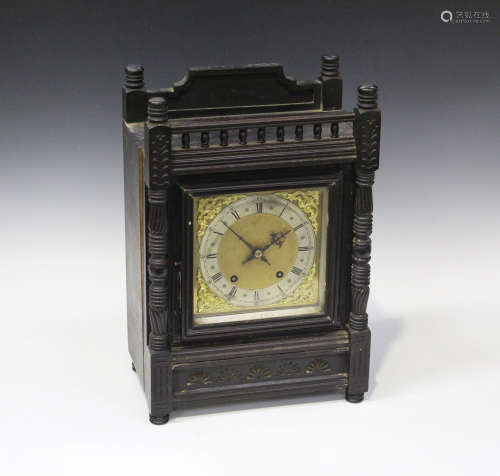 A late 19th century German ebonized walnut mantel clock with eight day movement striking on a