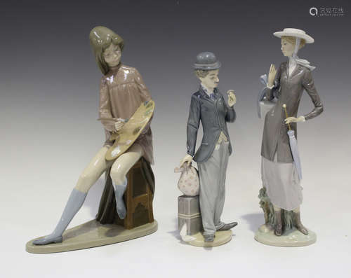 Two Lladro porcelain figures, comprising Charlie The Tramp, No. 5233, and A New Hat, No. 5345,