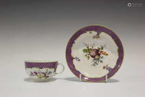 A Meissen porcelain cabinet cup and saucer, late 18th century, painted with fruit, flowers, nuts and