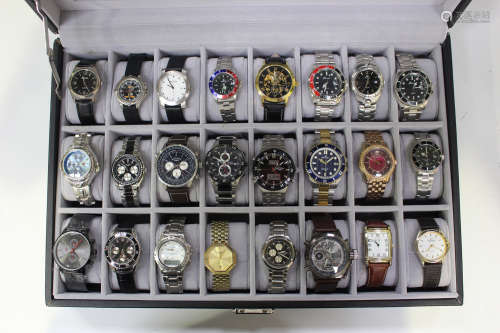 A collection of twenty-four gentlemen's wristwatches, including a Rotary steel chronograph with blue