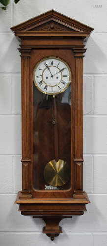 A mid to late 19th century Austrian walnut cased Vienna wall clock with eight day Lenzkirch movement
