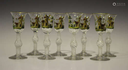 A set of eight Continental 18th century style wine glasses, each bell bowl polychrome enamelled with