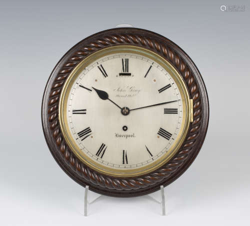 A mid-19th century mahogany circular cased ship's style wall timepiece with eight day chain fusee